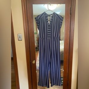 Striped navy jumpsuit fits like a small sized large